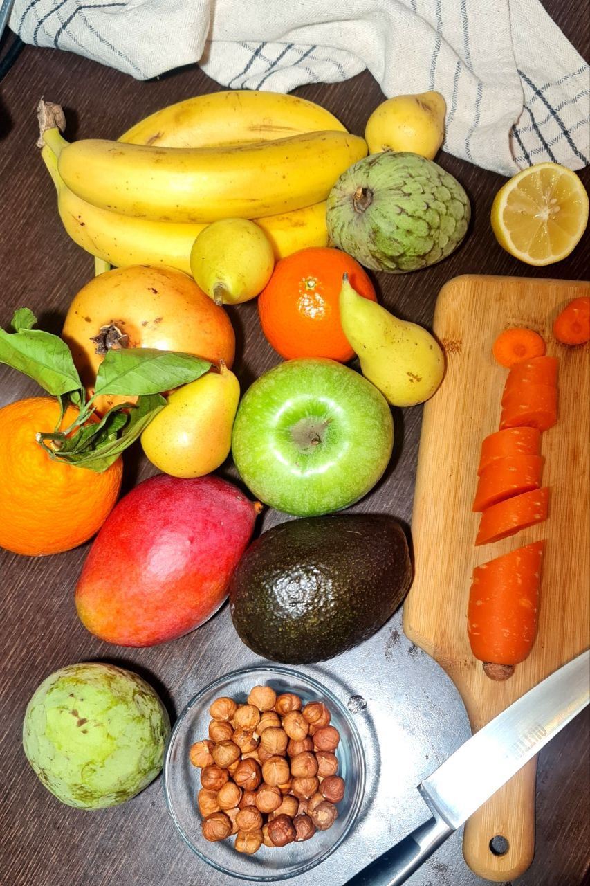 A selection of vegan ingredients, kitchen tools, and prepared plant-based dishes on a counter, illustrating vegan cooking tips