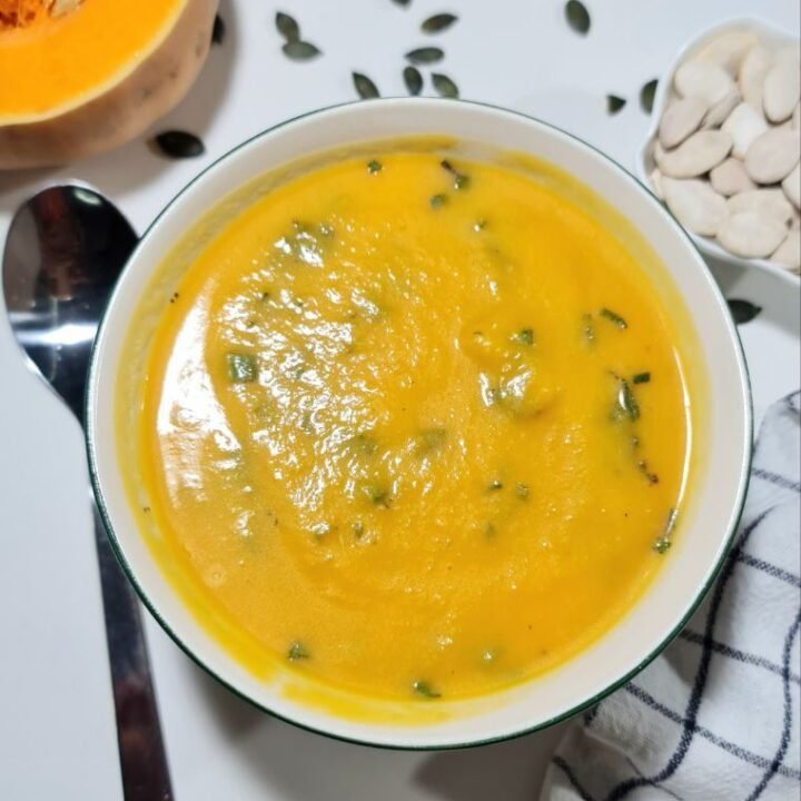 butternut squash soup bowl, pumpkin seeds, tablespoon