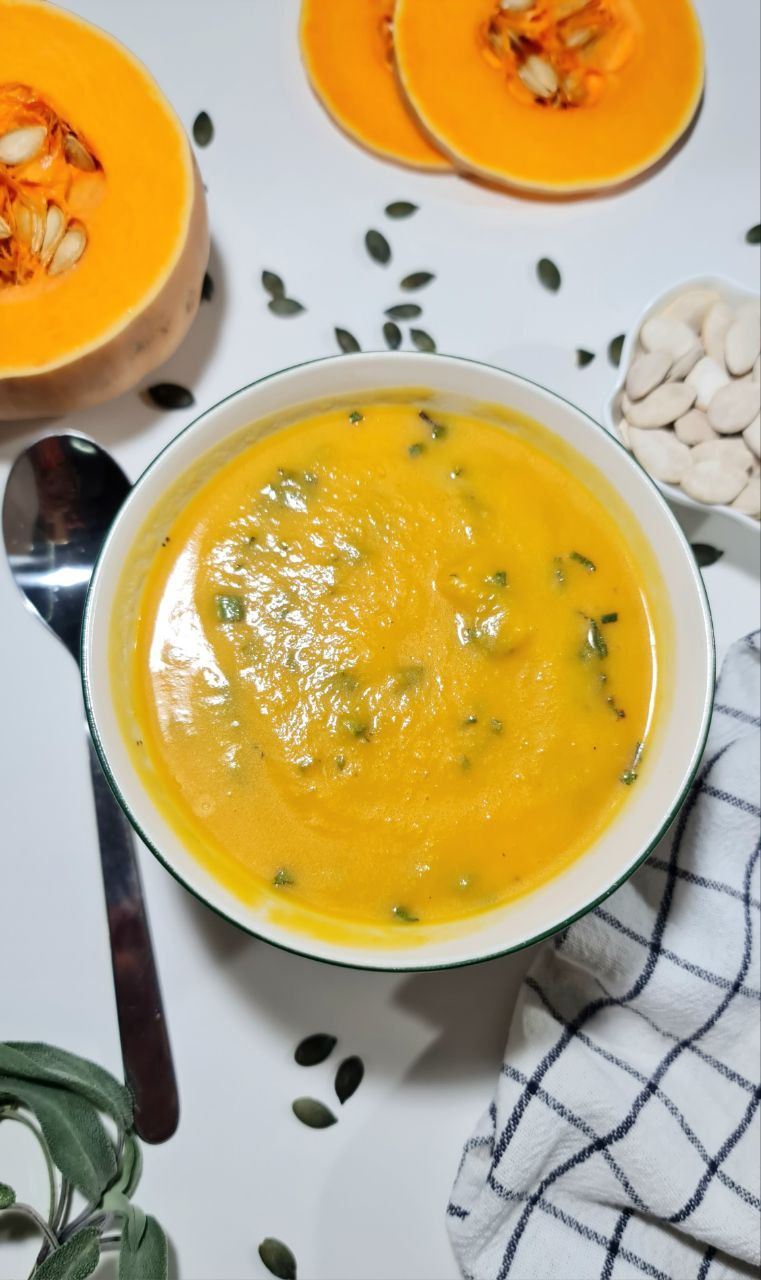 butternut squash soup bowl, pumpkin seeds, tablespoon