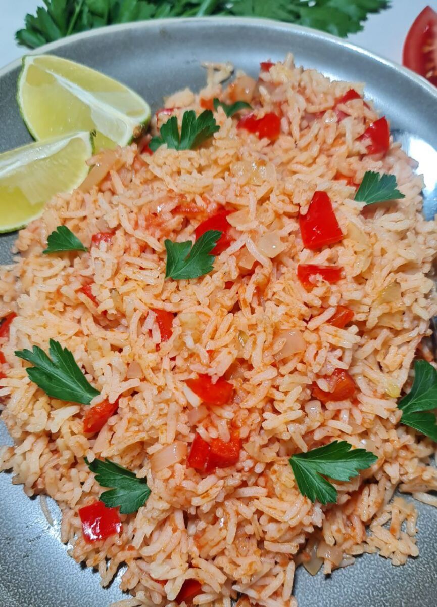 Vegan Spanish rice recipe with vibrant vegetables and spices, served in a bowl.