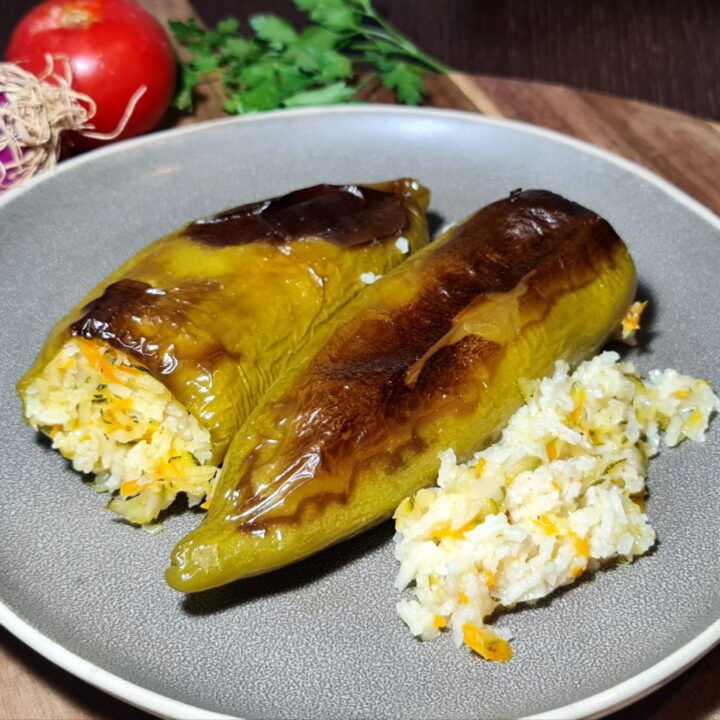 Close-up of stuffed peppers filled with rice and vegetables.