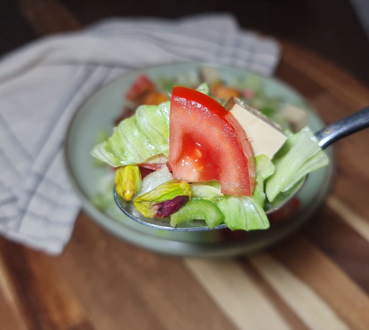 a spoonful of salad on a plate