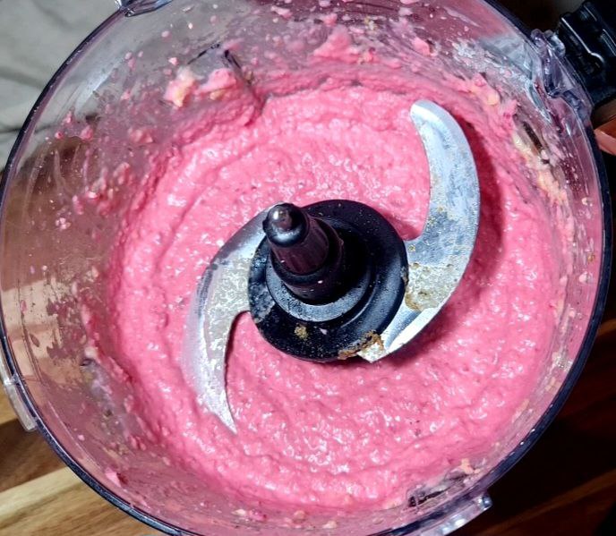 a blender with pink liquid in it