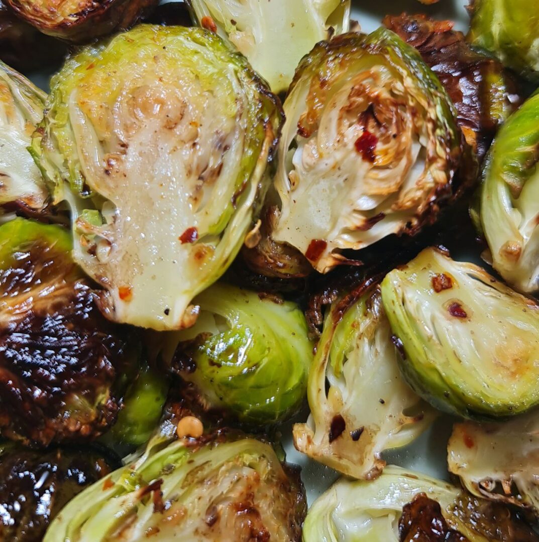  Close-up of roasted Brussels sprouts with crispy edges.  Close-up of roasted Brussels sprouts with crispy edges and tender insides.