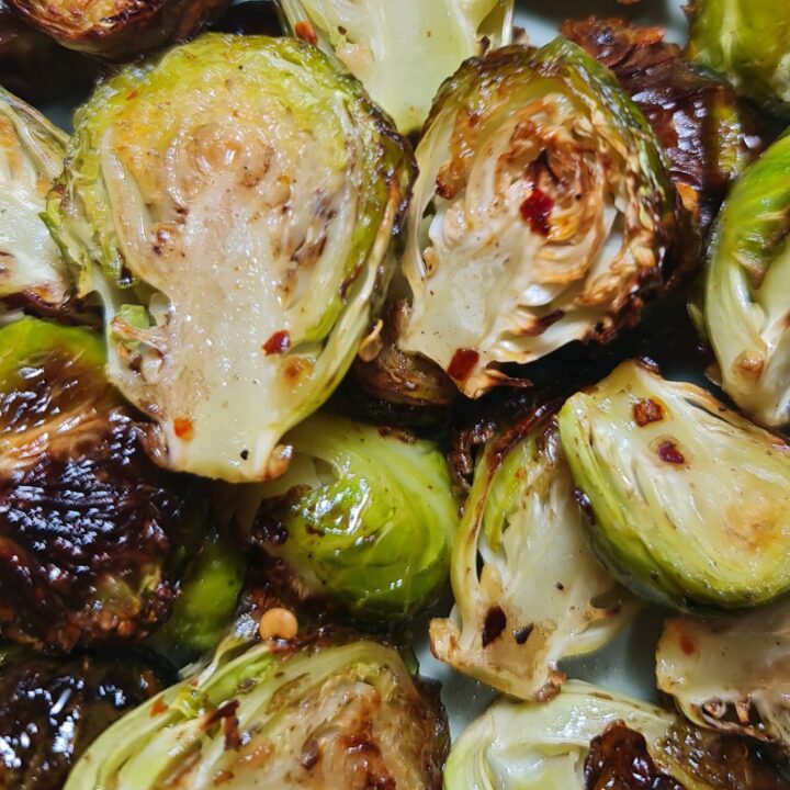 Close-up of roasted Brussels sprouts with crispy edges. Close-up of roasted Brussels sprouts with crispy edges and tender insides.