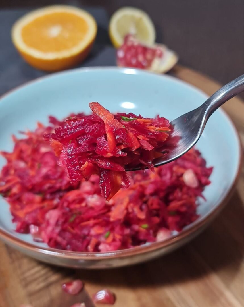  Close-up of a forkful of fall beetroot salad showing the vibrant colors and fresh ingredients.  A closer look at the delicious fall beetroot salad, ready to be enjoyed.