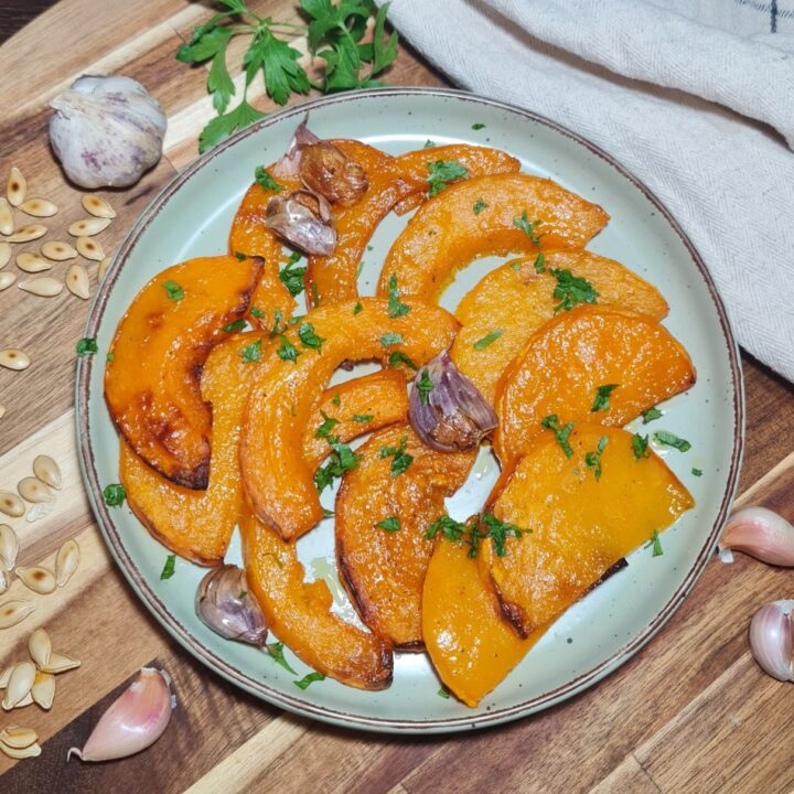 a plate of food on a wooden surface - roasted butternut squash recipe