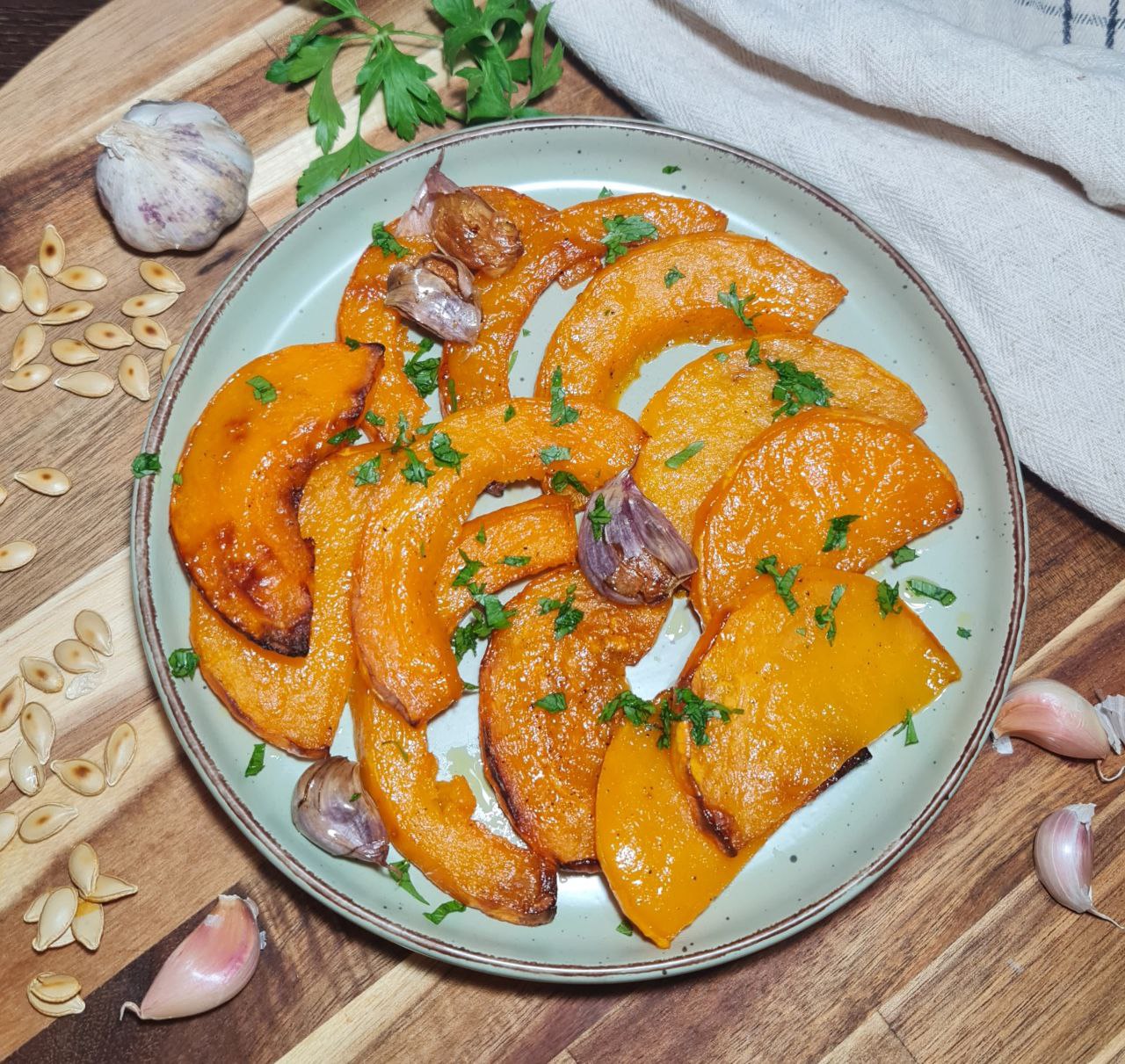 a plate of food on a wooden surface - roasted butternut squash recipe