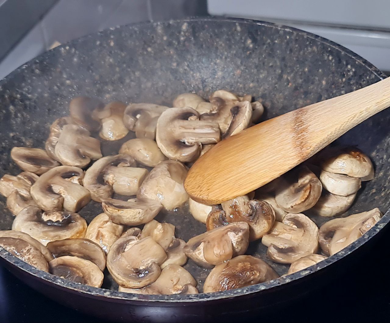 mushrooms cooking in a pan