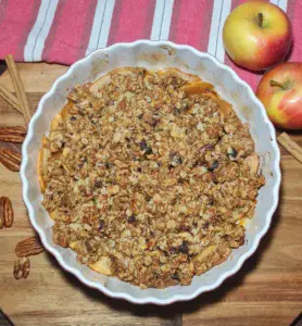 Bowl of warm vegan apple crisp. Warm vegan apple crisp.