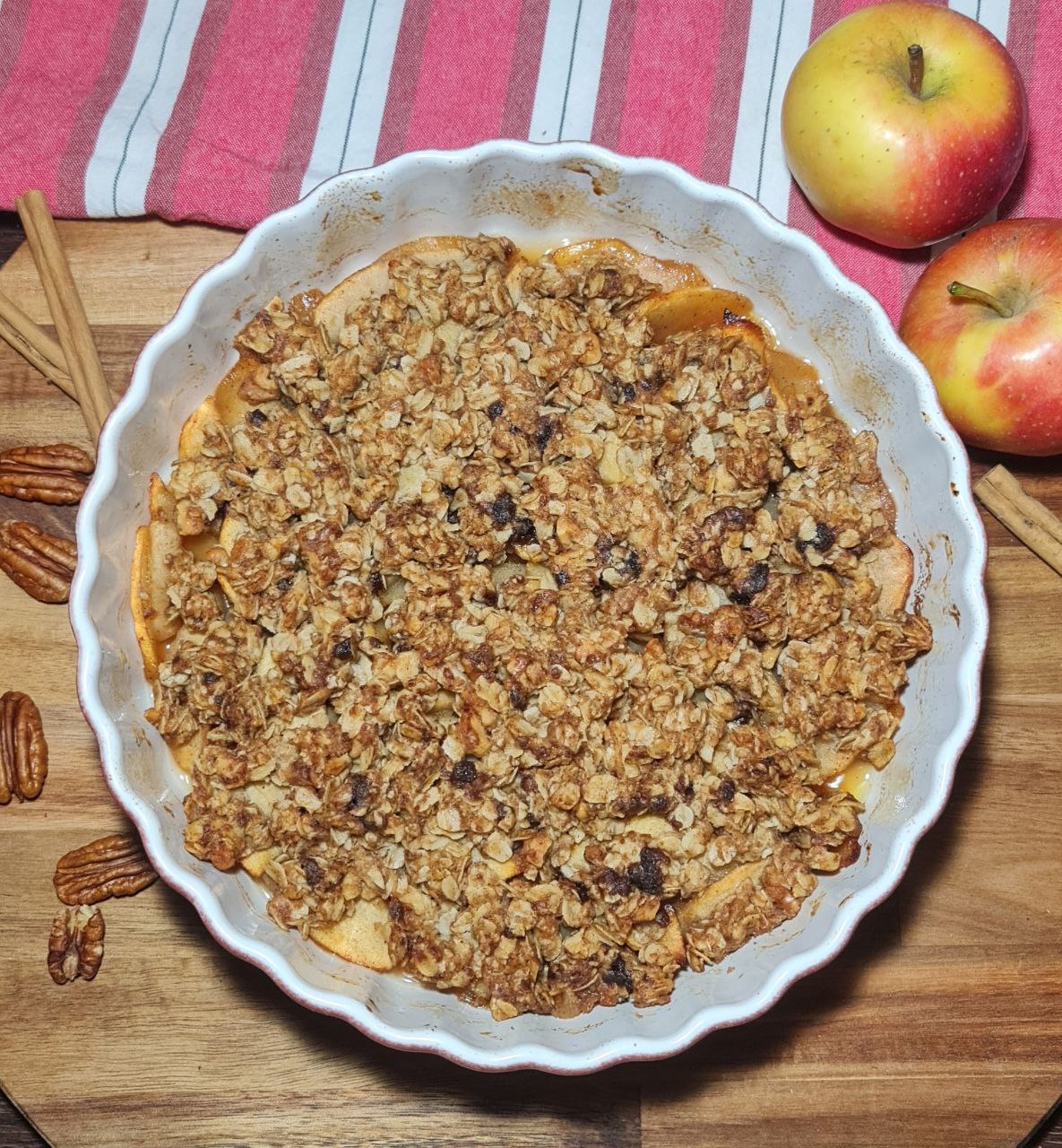 Bowl of warm vegan apple crisp. Warm vegan apple crisp.