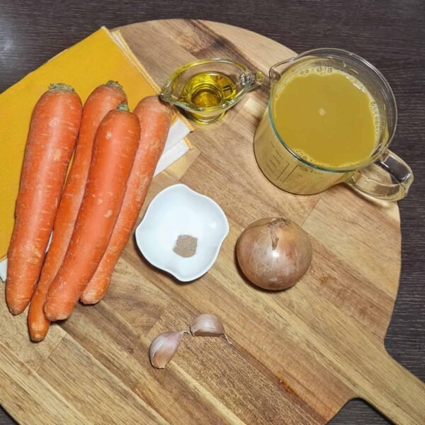 Fresh carrots, onion, garlic, olive oil, and vegetable broth for carrot soup