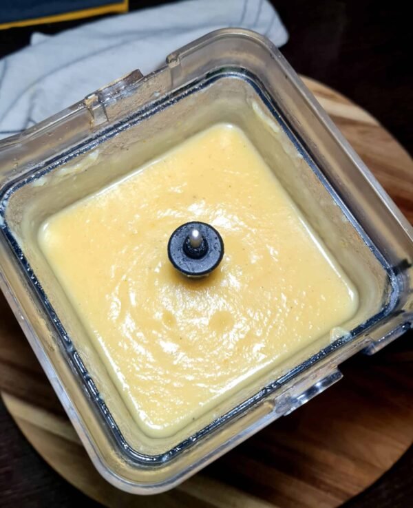 Freshly blended Irish vegetable soup inside a blender, showing its smooth and creamy consistency.