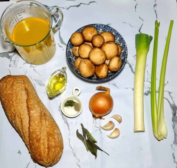 Close-up of a spoonful of vegan stuffing with toasted bread and mushrooms.